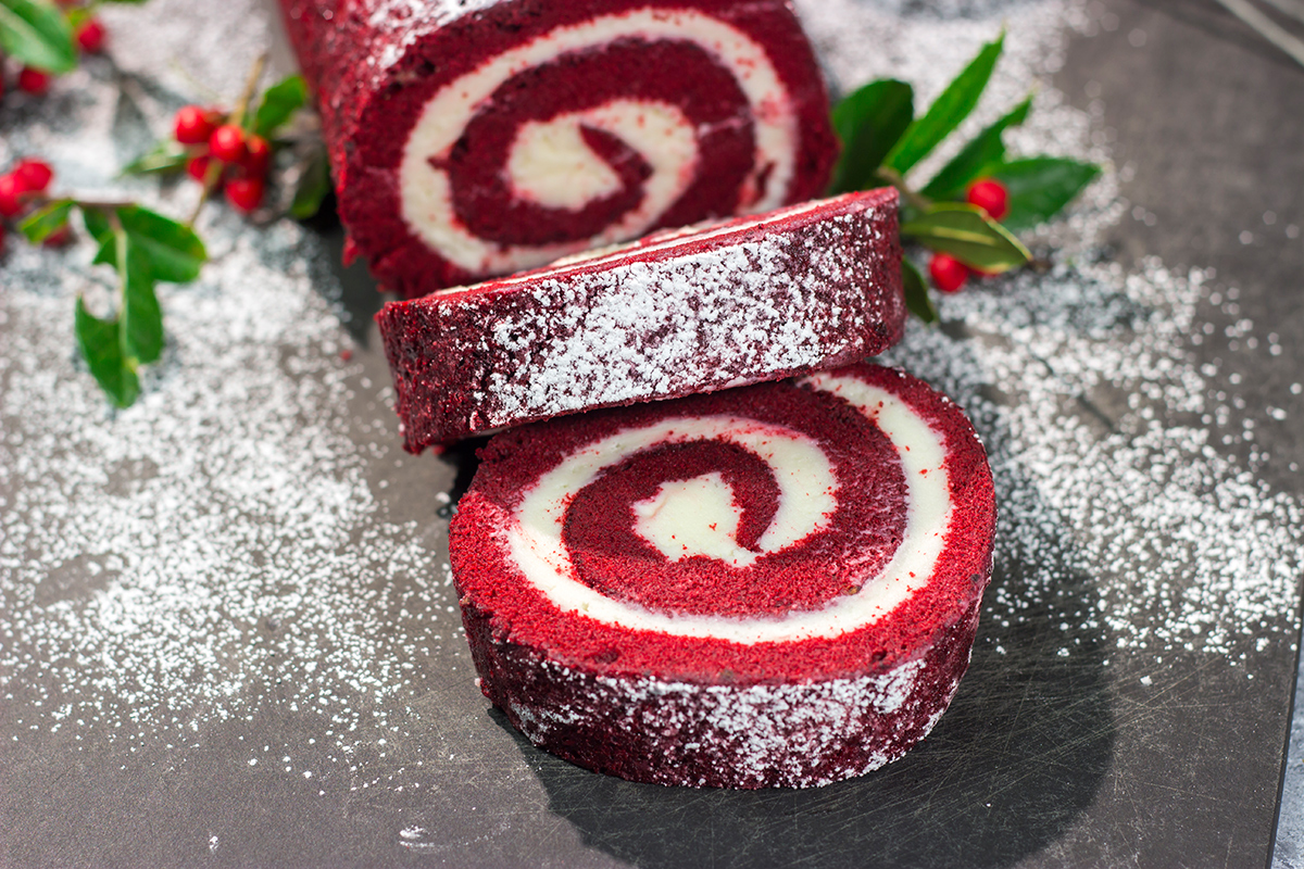 This festive Red Velvet Cake Roll is filled with a classic cream cheese frosting. The soft and chocolatey cake combined with the creamy frosting is delicious!