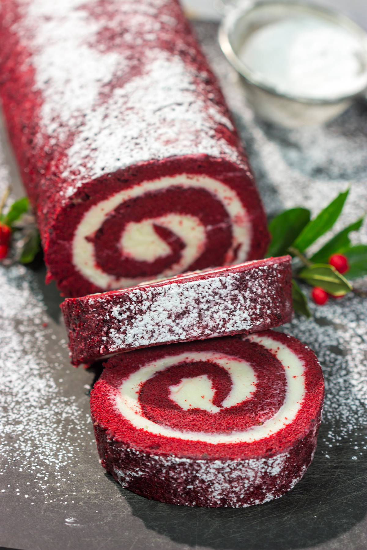 This festive Red Velvet Cake Roll is filled with a classic cream cheese frosting. The soft and chocolatey cake combined with the creamy frosting is delicious!