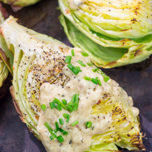 Tired of the same veggies every night? Grab a cabbage! These Roasted Cabbage Wedges get paired with a mustard cream sauce for a unique and delicious side dish!