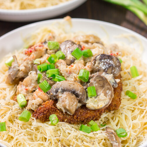 Inspired by the dish from Copeland's of New Orleans, Chicken Rene features garlic butter pasta topped with fried chicken, mushrooms, crab and crawfish. It's delicious!