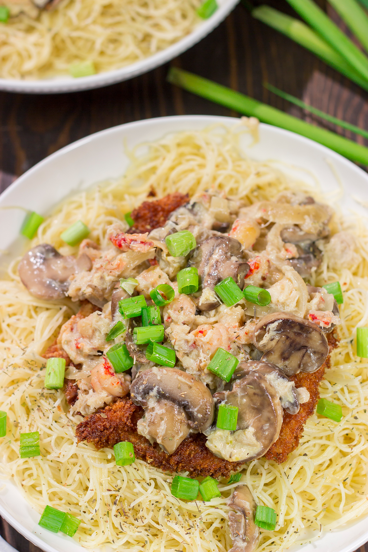 Inspired by the dish from Copeland's of New Orleans, Chicken Rene features garlic butter pasta topped with fried chicken, mushrooms, crab and crawfish. It's delicious!