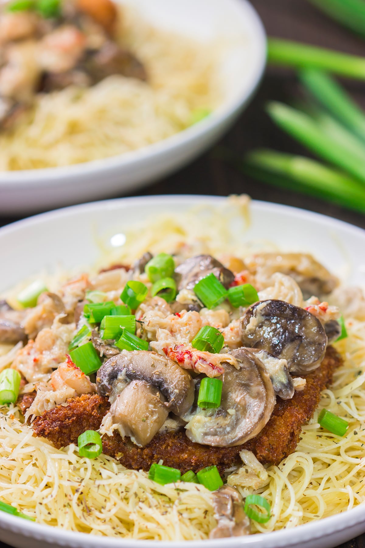 Inspired by the dish from Copeland's of New Orleans, Chicken Rene features garlic butter pasta topped with fried chicken, mushrooms, crab and crawfish. It's delicious!