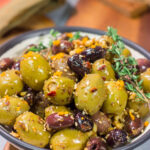 Featuring orange zest, walnuts and za'atar seasoning, these Citrus Olives with Za'atar make for a unique and delicious appetizer!