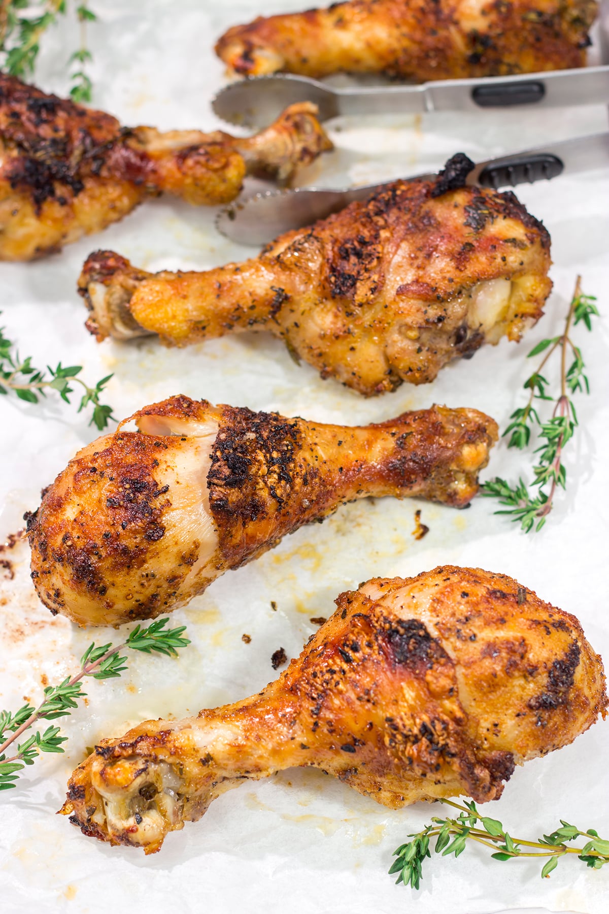 With only 10-minutes of prep time, these Crispy Baked Chicken Drumsticks make for an easy weeknight meal. They taste just like rotisserie chicken!