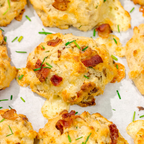 Want homemade biscuits for dinner? This easy Bacon Cheese Drop Biscuits recipe is packed with flavor! Whip up a batch today!