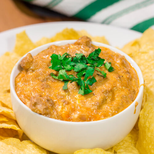 This easy Slow Cooker Cheesy Mexican Dip is packed with flavor! It's the perfect appetizer for watching games with friends.