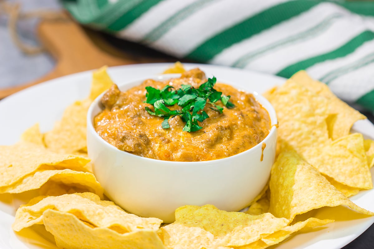 This easy Slow Cooker Cheesy Mexican Dip is packed with flavor! It's the perfect appetizer for watching games with friends.