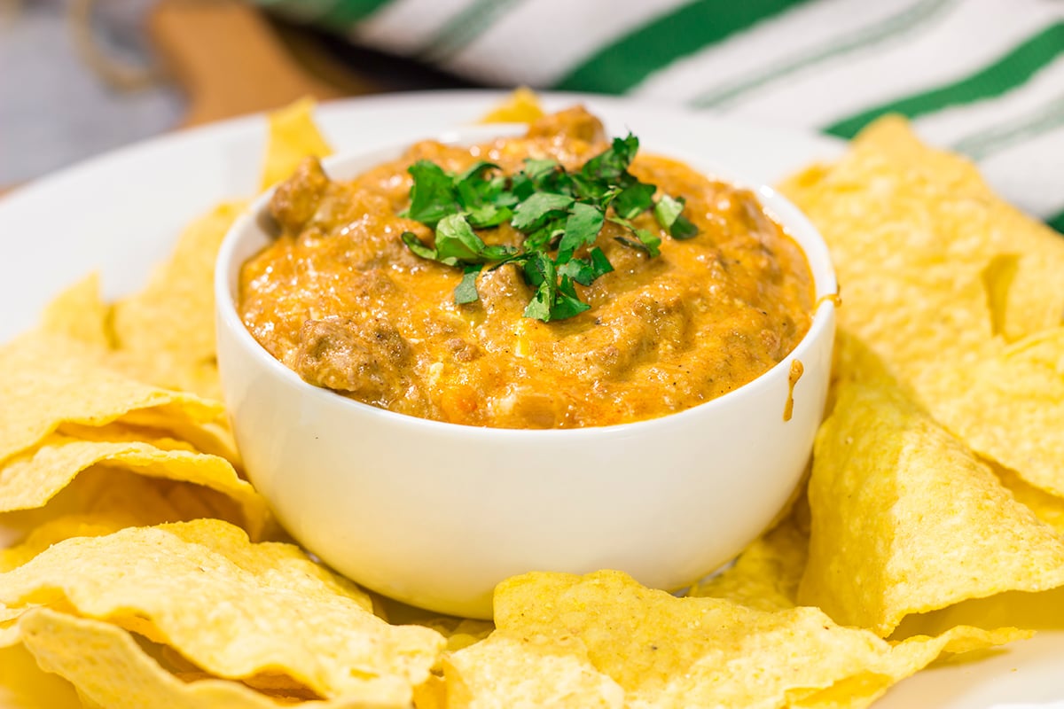 This easy Slow Cooker Cheesy Mexican Dip is packed with flavor! It's the perfect appetizer for watching games with friends.