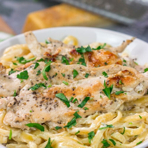 Fettuccine Alfredo features fettuccine pasta tossed with a rich, decadent cream sauce. Make a batch of this classic comfort food for dinner tonight!