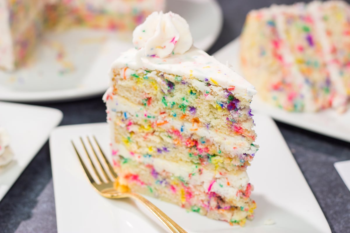 This light and fluffy Funfetti Layer Cake features a delicious vanilla cake with lots of sprinkles and a vanilla buttercream...with more sprinkles! It makes a great birthday cake...or for any other special occasion.
