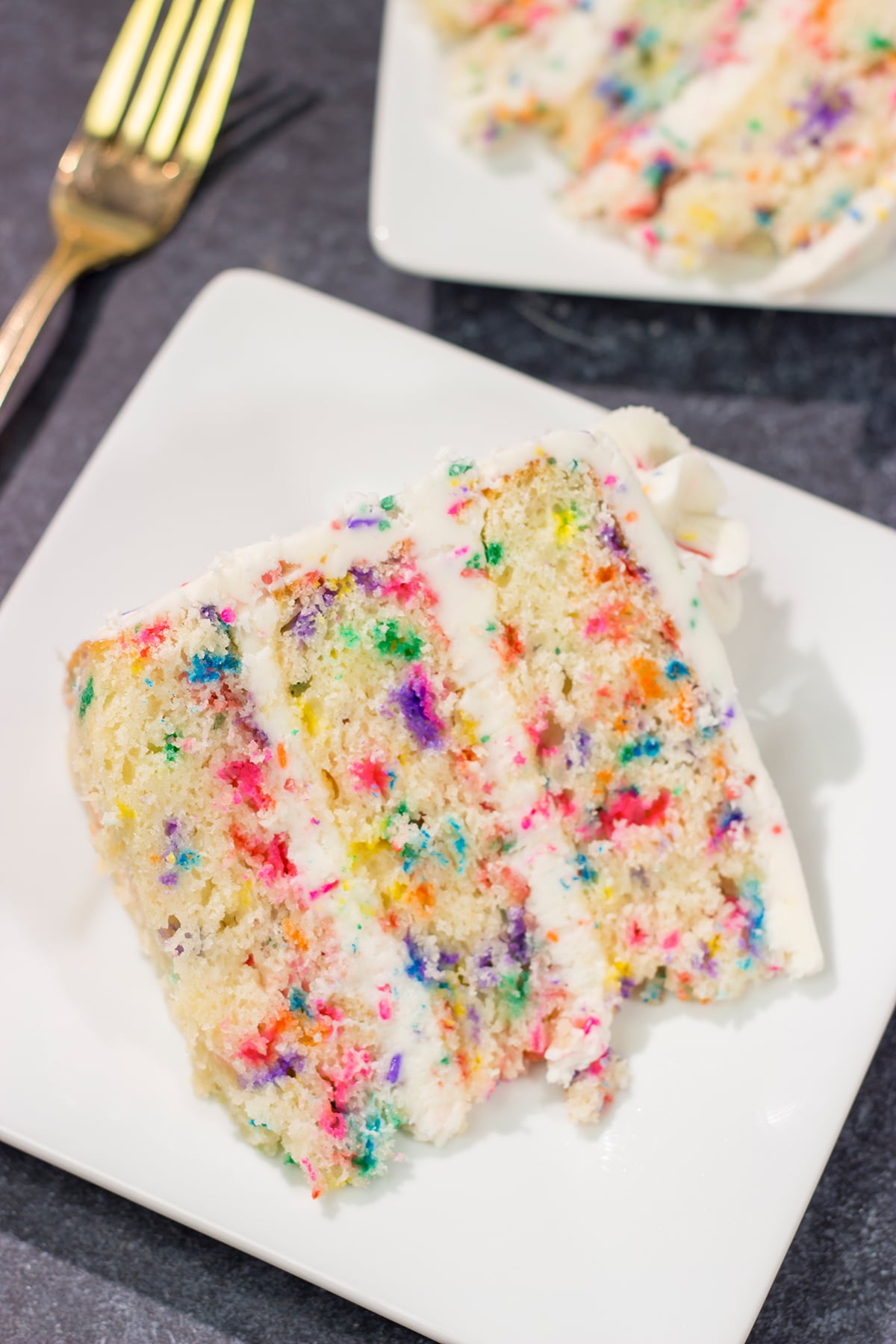 This light and fluffy Funfetti Layer Cake features a delicious vanilla cake with lots of sprinkles and a vanilla buttercream...with more sprinkles! It makes a great birthday cake...or for any other special occasion.