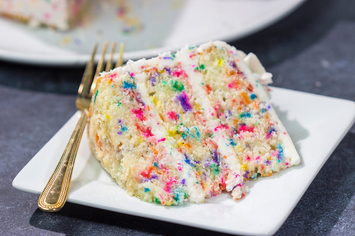 This light and fluffy Funfetti Layer Cake features a delicious vanilla cake with lots of sprinkles and a vanilla buttercream...with more sprinkles! It makes a great birthday cake...or for any other special occasion.