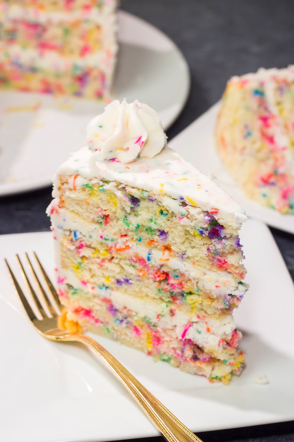 This light and fluffy Funfetti Layer Cake features a delicious vanilla cake with lots of sprinkles and a vanilla buttercream...with more sprinkles! It makes a great birthday cake...or for any other special occasion.
