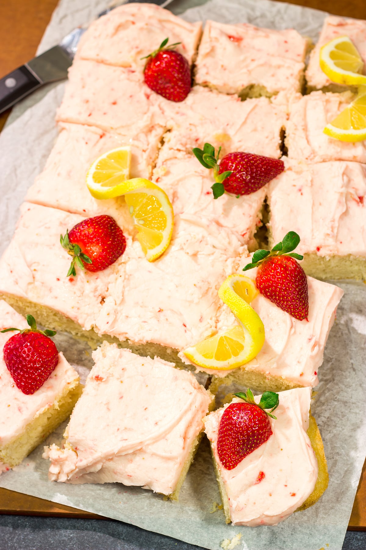Celebrate warm weather season with this Lemon Strawberry Cake! This dessert features an eggless lemon cake topped with a luscious strawberry buttercream frosting.