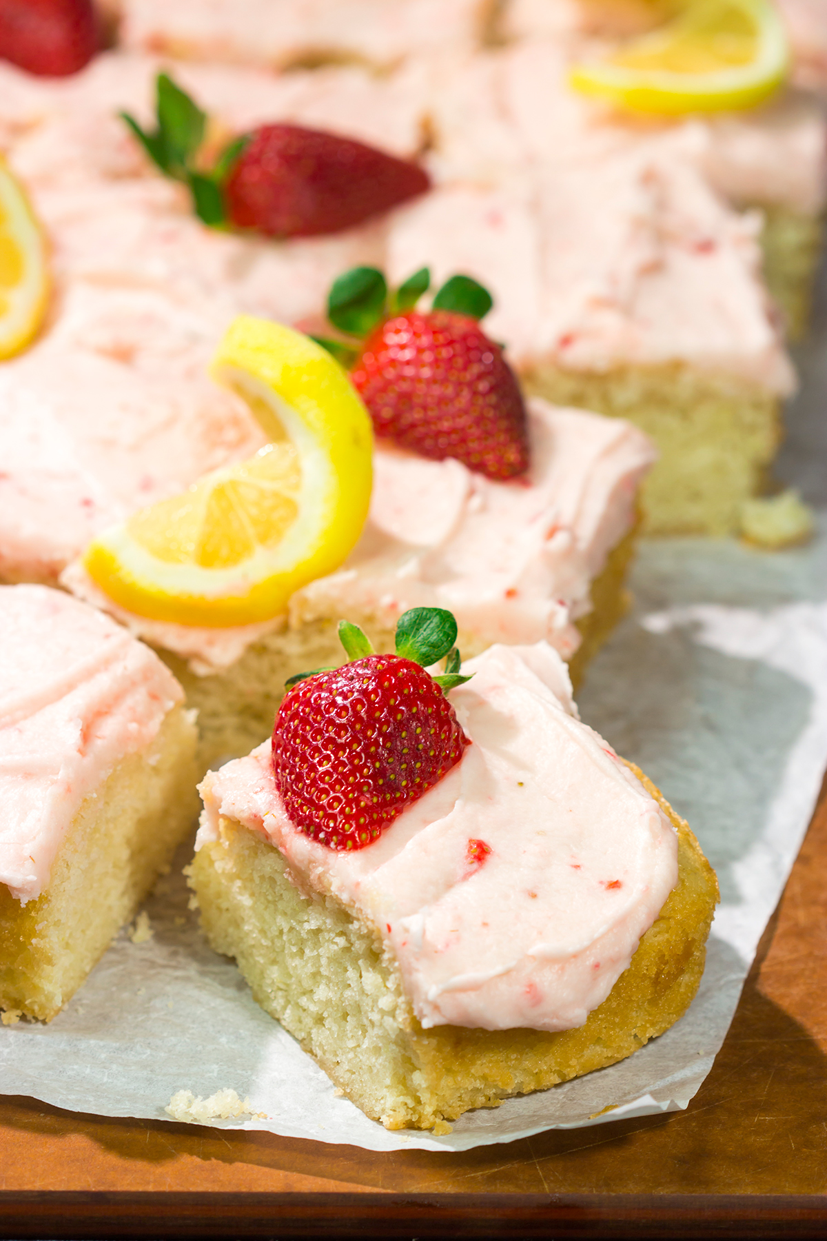 Celebrate warm weather season with this Lemon Strawberry Cake! This dessert features an eggless lemon cake topped with a luscious strawberry buttercream frosting.