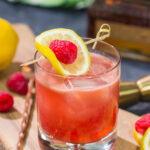 This Raspberry Bourbon Lemonade is a great summer cocktail! Made from fresh raspberries and real lemons, this whiskey cocktail is great for parties in the backyard. Cheers!