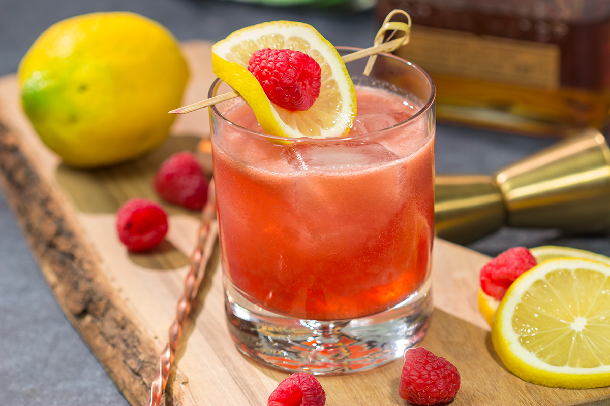 This Raspberry Bourbon Lemonade is a great summer cocktail! Made from fresh raspberries and real lemons, this whiskey cocktail is great for parties in the backyard. Cheers!