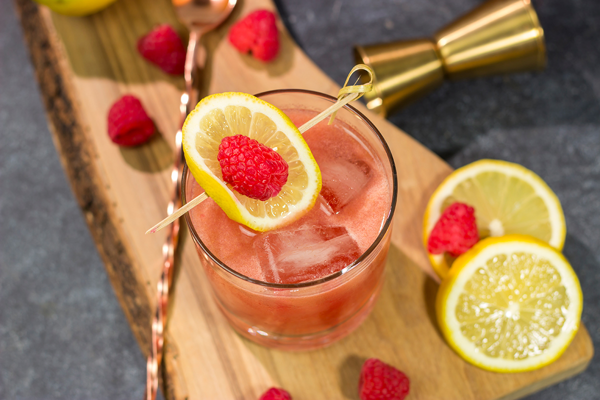 This Raspberry Bourbon Lemonade is a great summer cocktail! Made from fresh raspberries and real lemons, this whiskey cocktail is great for parties in the backyard. Cheers!
