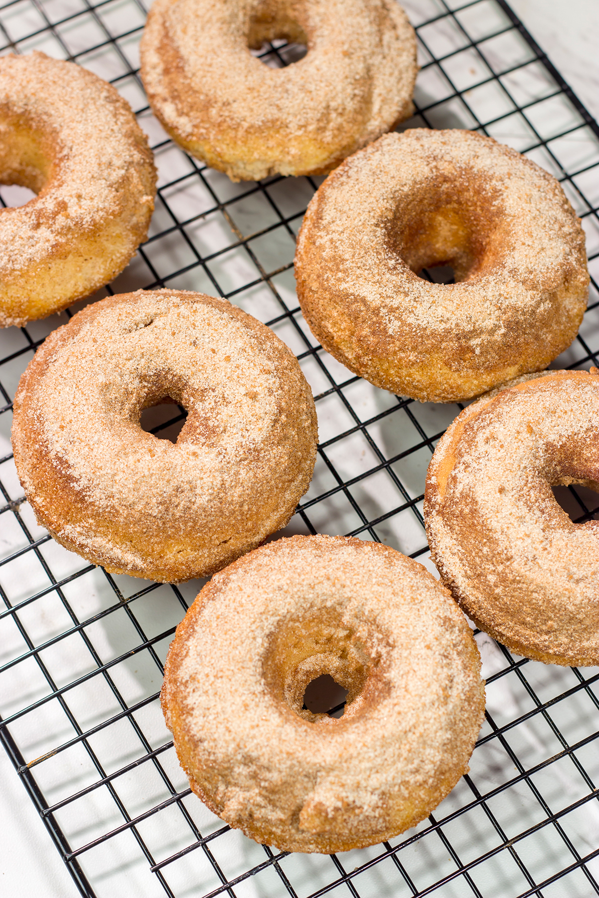 Craving a sweet treat? Make a batch of these Baked Cinnamon Sugar Doughnuts. Ready in less than 45 minutes, these doughnuts are always a family favorite!