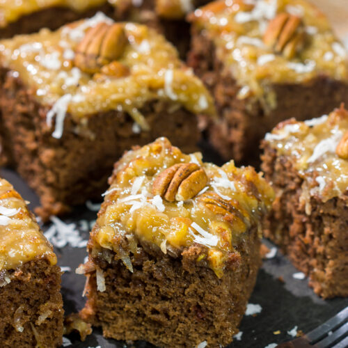 This sheet pan version of the classic German Chocolate Cake features a mild chocolate cake topped with a gooey coconut pecan frosting. It's perfect for picnics and family gatherings!