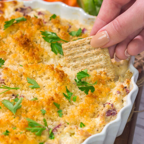 This Reuben Dip recipe features all of the flavors of the classic deli sandwich...in appetizer form. Grab some crackers and dig in!