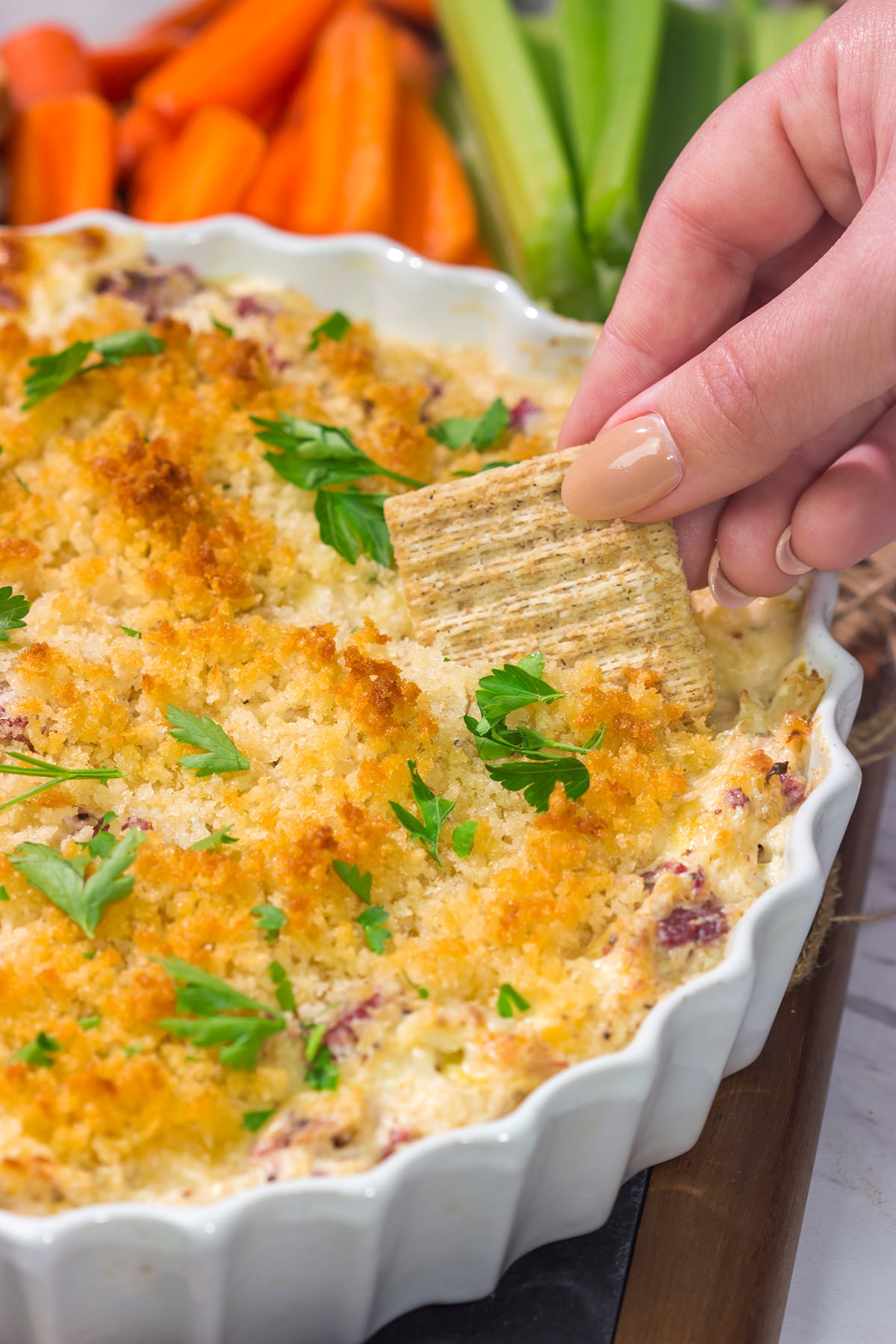 This Reuben Dip recipe features all of the flavors of the classic deli sandwich...in appetizer form. Grab some crackers and dig in!