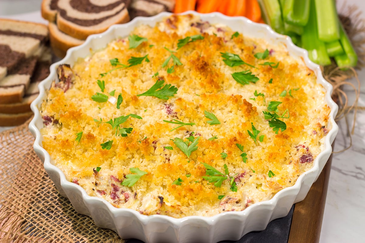 This Reuben Dip recipe features all of the flavors of the classic deli sandwich...in appetizer form. Grab some crackers and dig in!