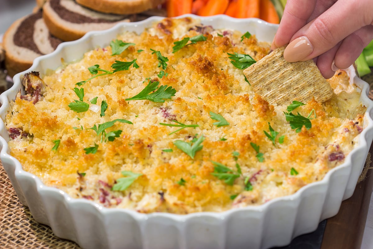 This Reuben Dip recipe features all of the flavors of the classic deli sandwich...in appetizer form. Grab some crackers and dig in!