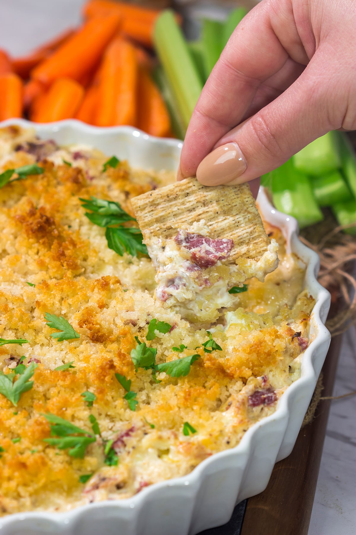 This Reuben Dip recipe features all of the flavors of the classic deli sandwich...in appetizer form. Grab some crackers and dig in!
