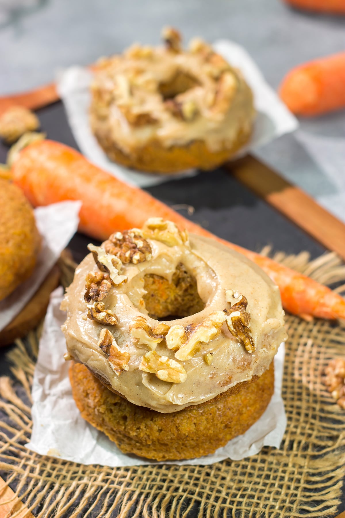 These baked Carrot Cake Donuts feature a tender and delicious donut topped with a creamy brown sugar + cream cheese frosting. These donuts are perfect for Easter!