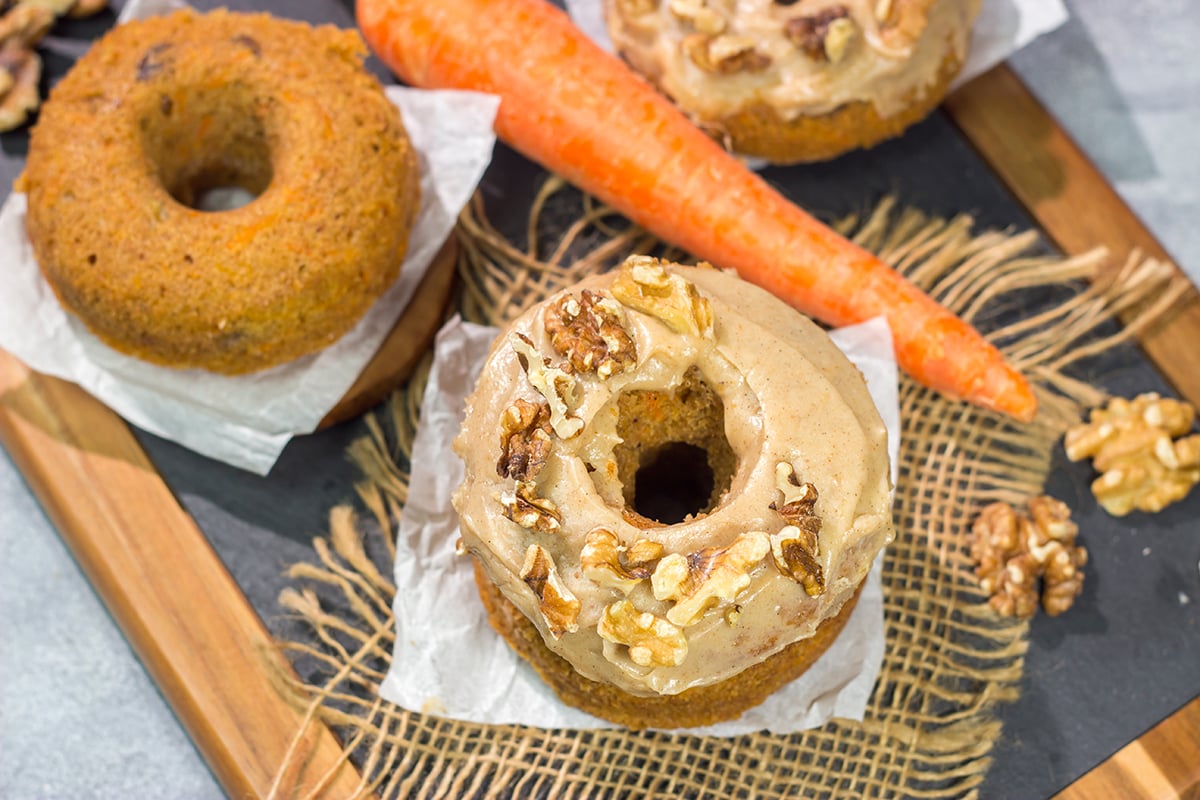These baked Carrot Cake Donuts feature a tender and delicious donut topped with a creamy brown sugar + cream cheese frosting. These donuts are perfect for Easter!