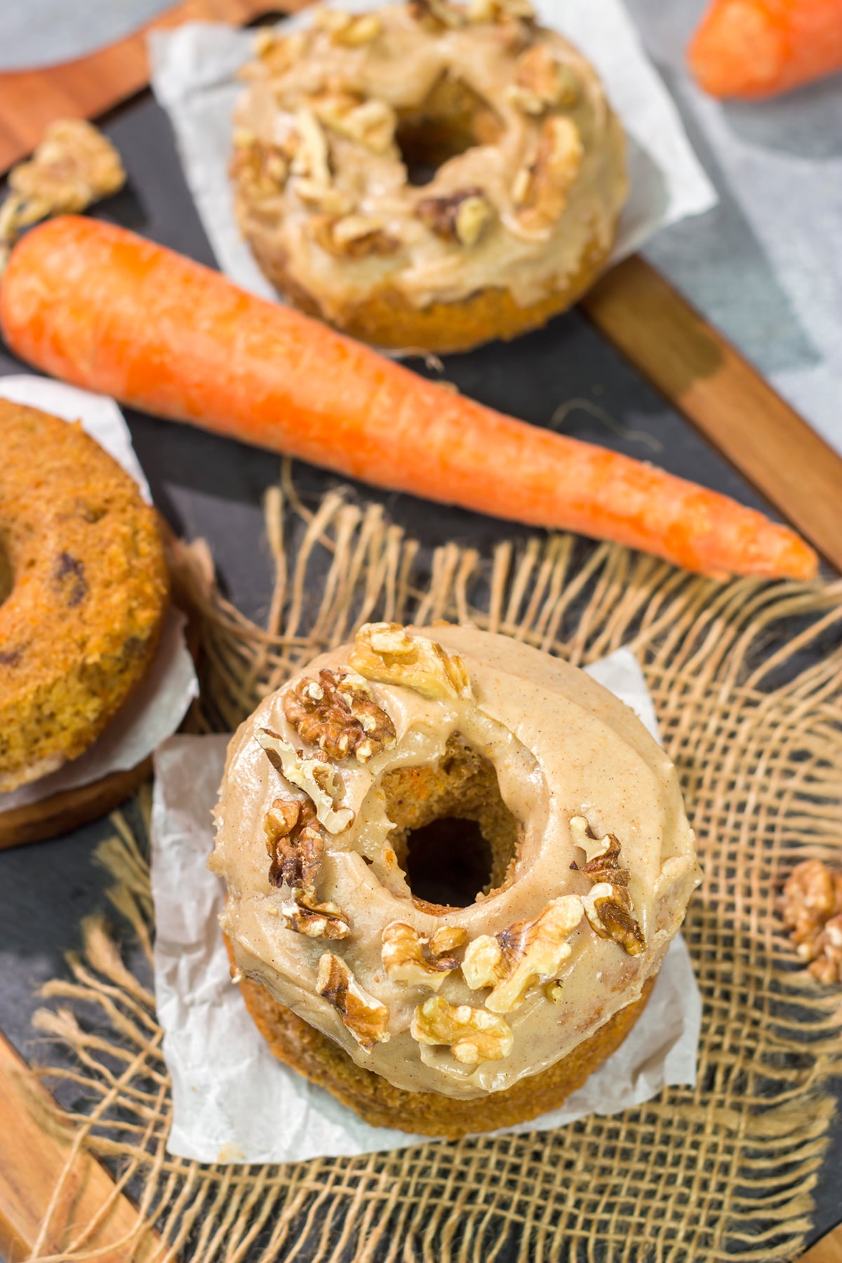 These baked Carrot Cake Donuts feature a tender and delicious donut topped with a creamy brown sugar + cream cheese frosting. These donuts are perfect for Easter!