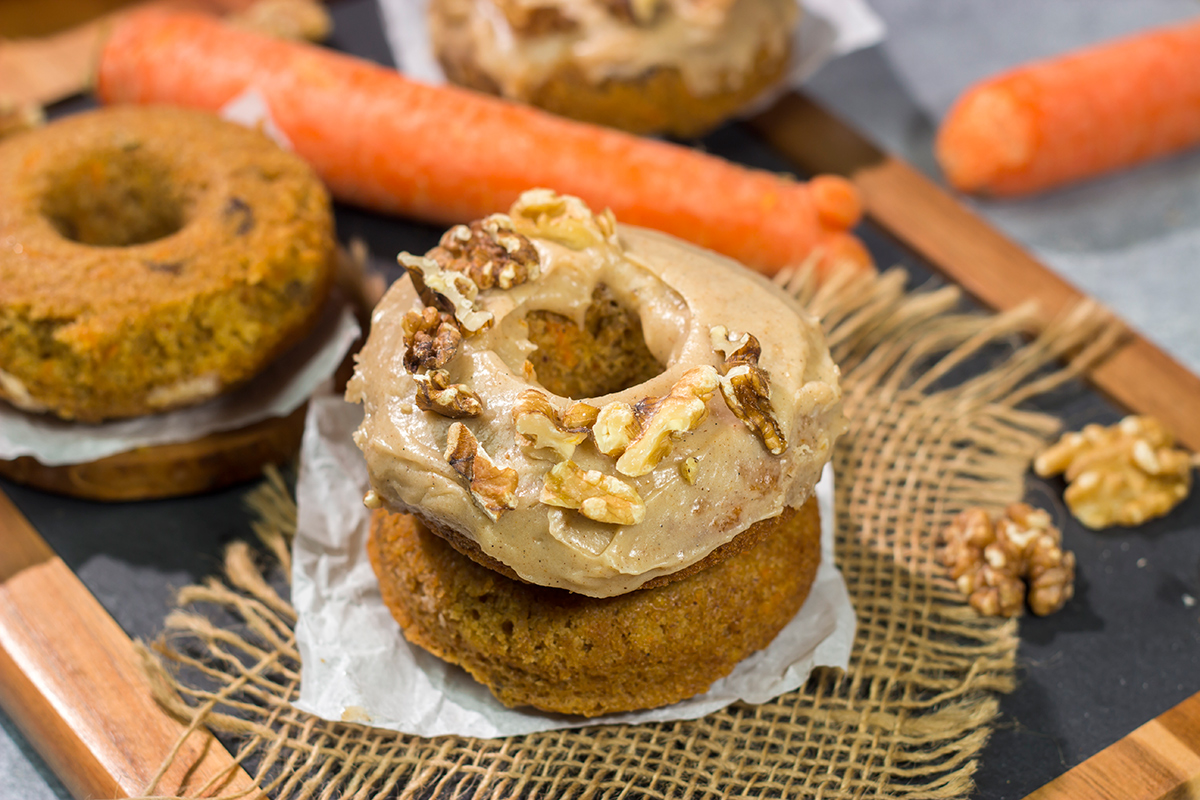 These baked Carrot Cake Donuts feature a tender and delicious donut topped with a creamy brown sugar + cream cheese frosting. These donuts are perfect for Easter!