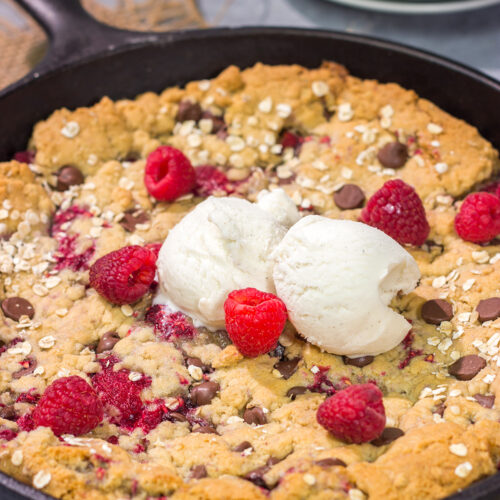 Who wants a gigantic cookie?? This Chocolate Raspberry Cookie is baked in a cast iron skillet, and it features fresh raspberries combined with chocolate chips. Yum!