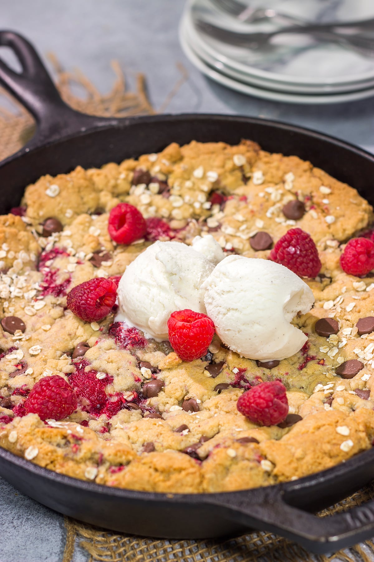 Who wants a gigantic cookie?? This Chocolate Raspberry Cookie is baked in a cast iron skillet, and it features fresh raspberries combined with chocolate chips. Yum!
