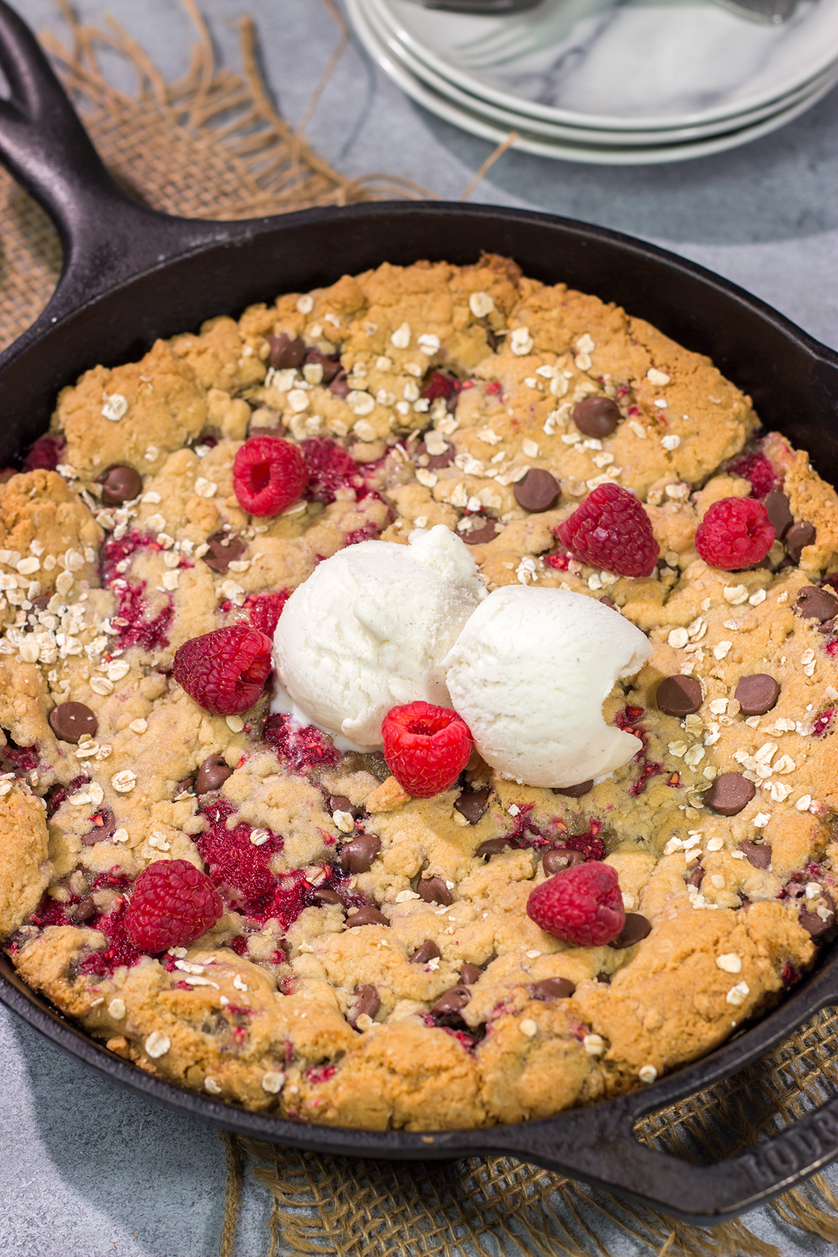 Who wants a gigantic cookie?? This Chocolate Raspberry Cookie is baked in a cast iron skillet, and it features fresh raspberries combined with chocolate chips. Yum!