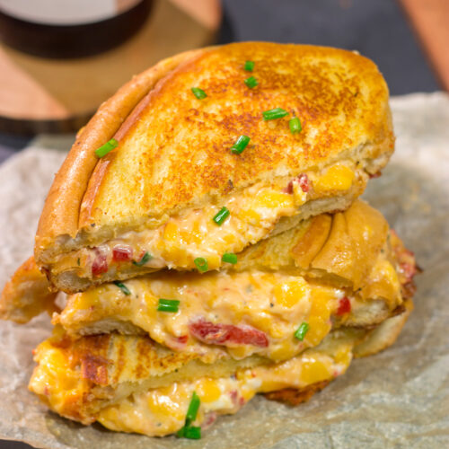 Take an old classic to a new level! These Pimento Grilled Cheese Sandwiches feature melty, creamy pimento cheese in between slices of buttered bread. Yum!