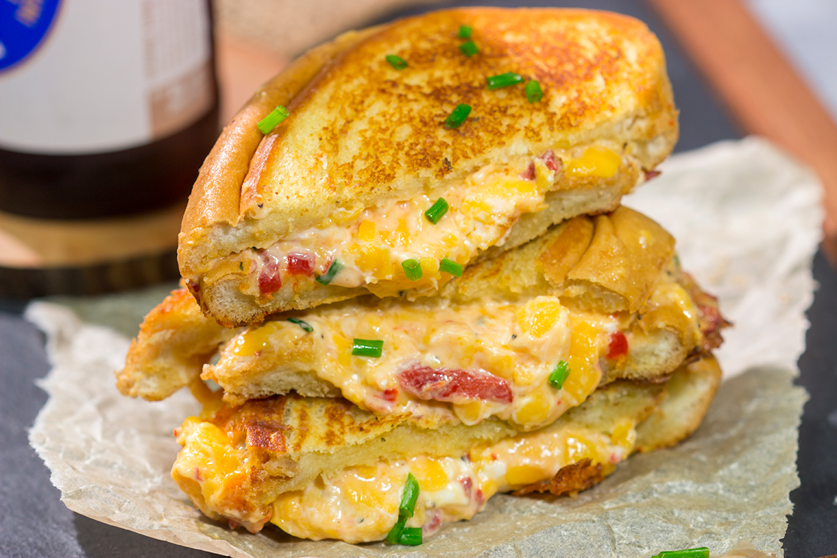 Take an old classic to a new level! These Pimento Grilled Cheese Sandwiches feature melty, creamy pimento cheese in between slices of buttered bread. Yum!