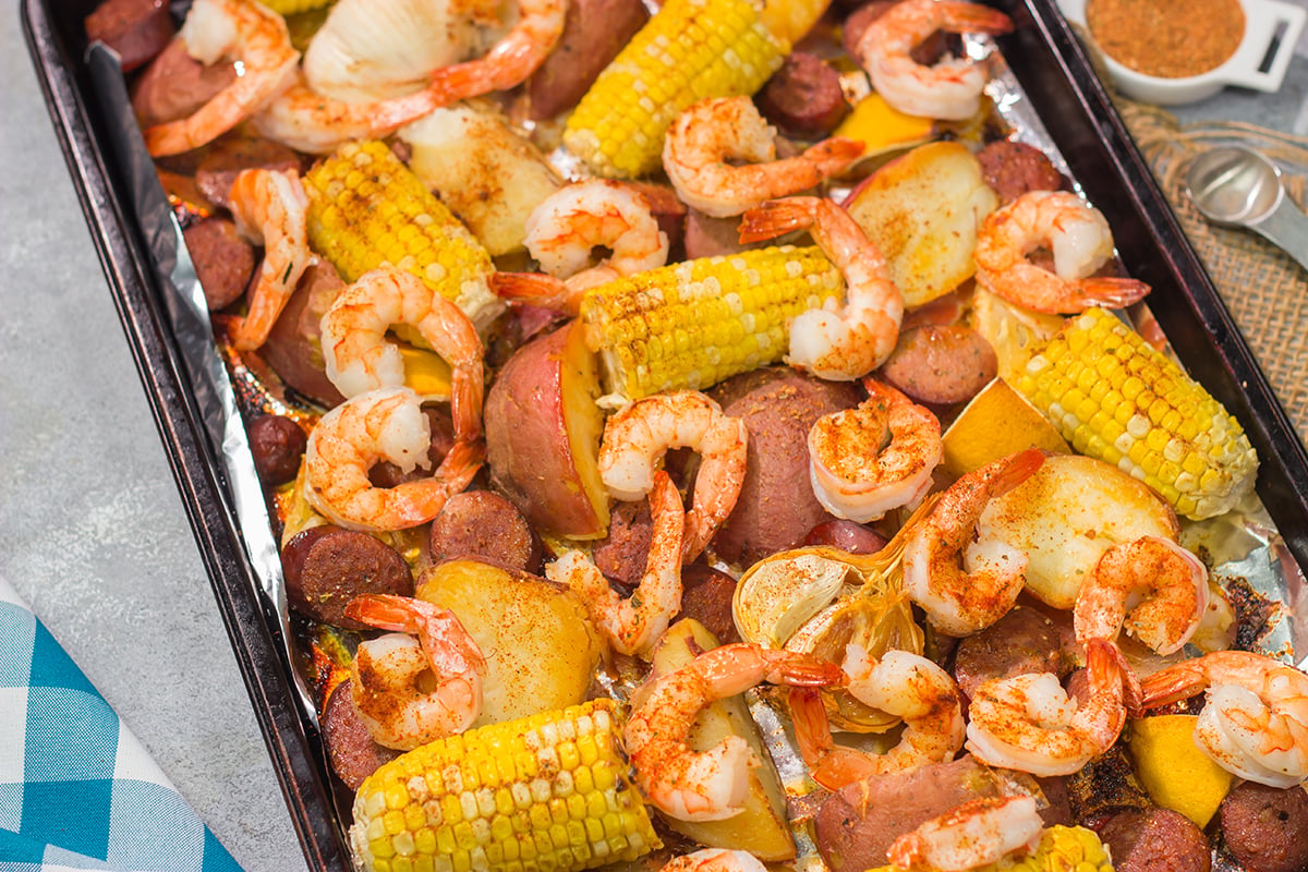 This Sheet Pan Lowcountry Boil recipe features all of the flavors of a traditional shrimp boil...but it gets baked in the oven instead!