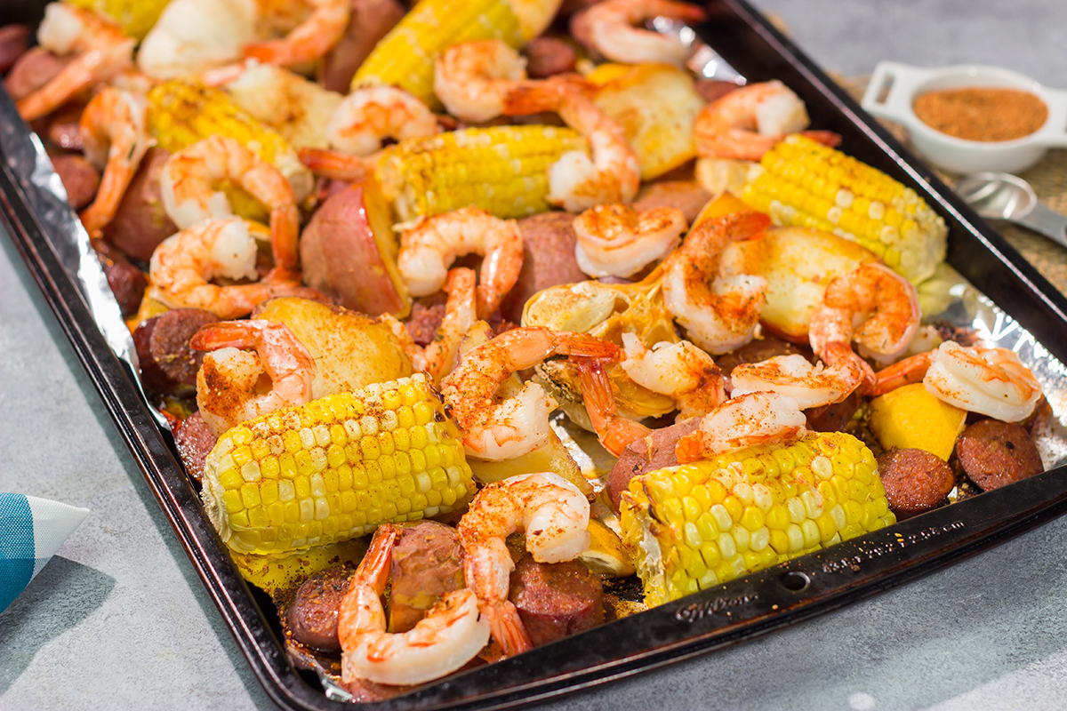 This Sheet Pan Lowcountry Boil recipe features all of the flavors of a traditional shrimp boil...but it gets baked in the oven instead!