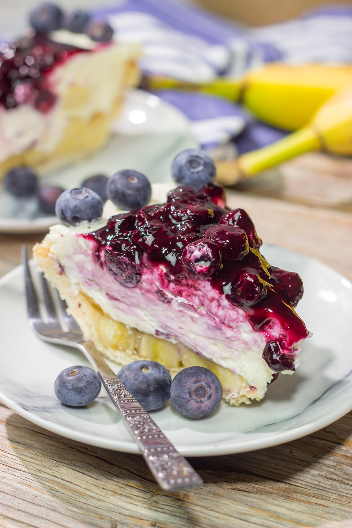This creamy, chilled Blueberry Banana Cream Cheese Pie is an easy and delicious dessert for a hot summer day. It's a great recipe for backyard parties!