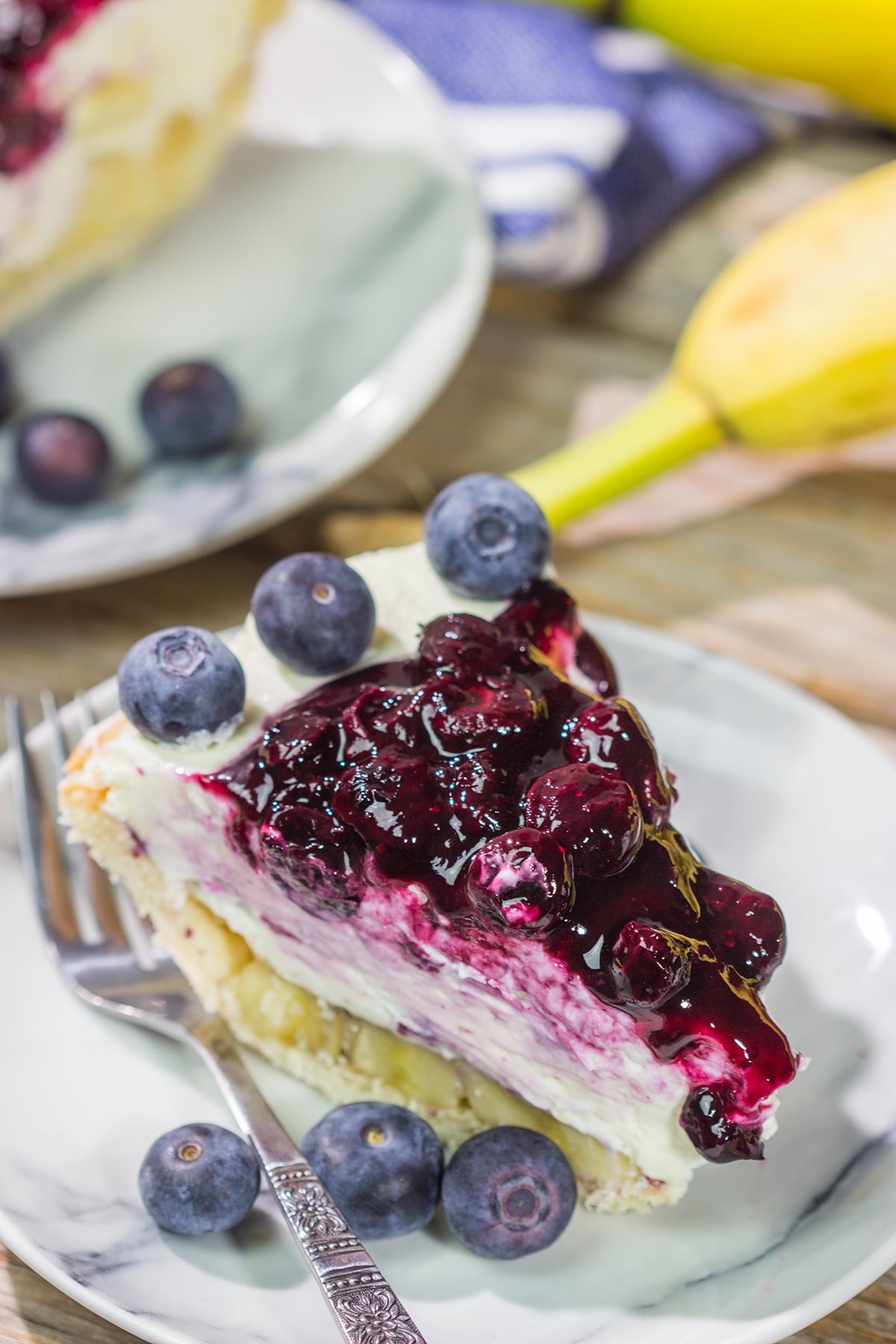 This creamy, chilled Blueberry Banana Cream Cheese Pie is an easy and delicious dessert for a hot summer day. It's a great recipe for backyard parties!
