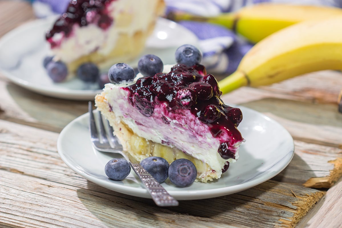 This creamy, chilled Blueberry Banana Cream Cheese Pie is an easy and delicious dessert for a hot summer day. It's a great recipe for backyard parties!