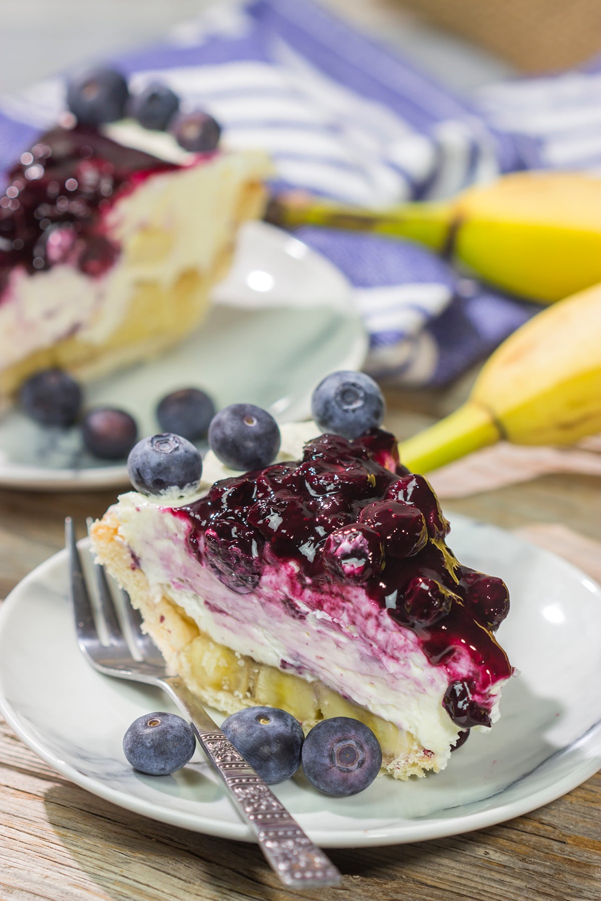 This creamy, chilled Blueberry Banana Cream Cheese Pie is an easy and delicious dessert for a hot summer day. It's a great recipe for backyard parties!