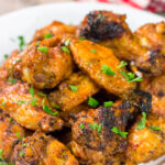 These Grilled Buffalo Wings are juicy and delicious - and tossed in an easy homemade buffalo sauce. Fire up the grill and invite some friends over!