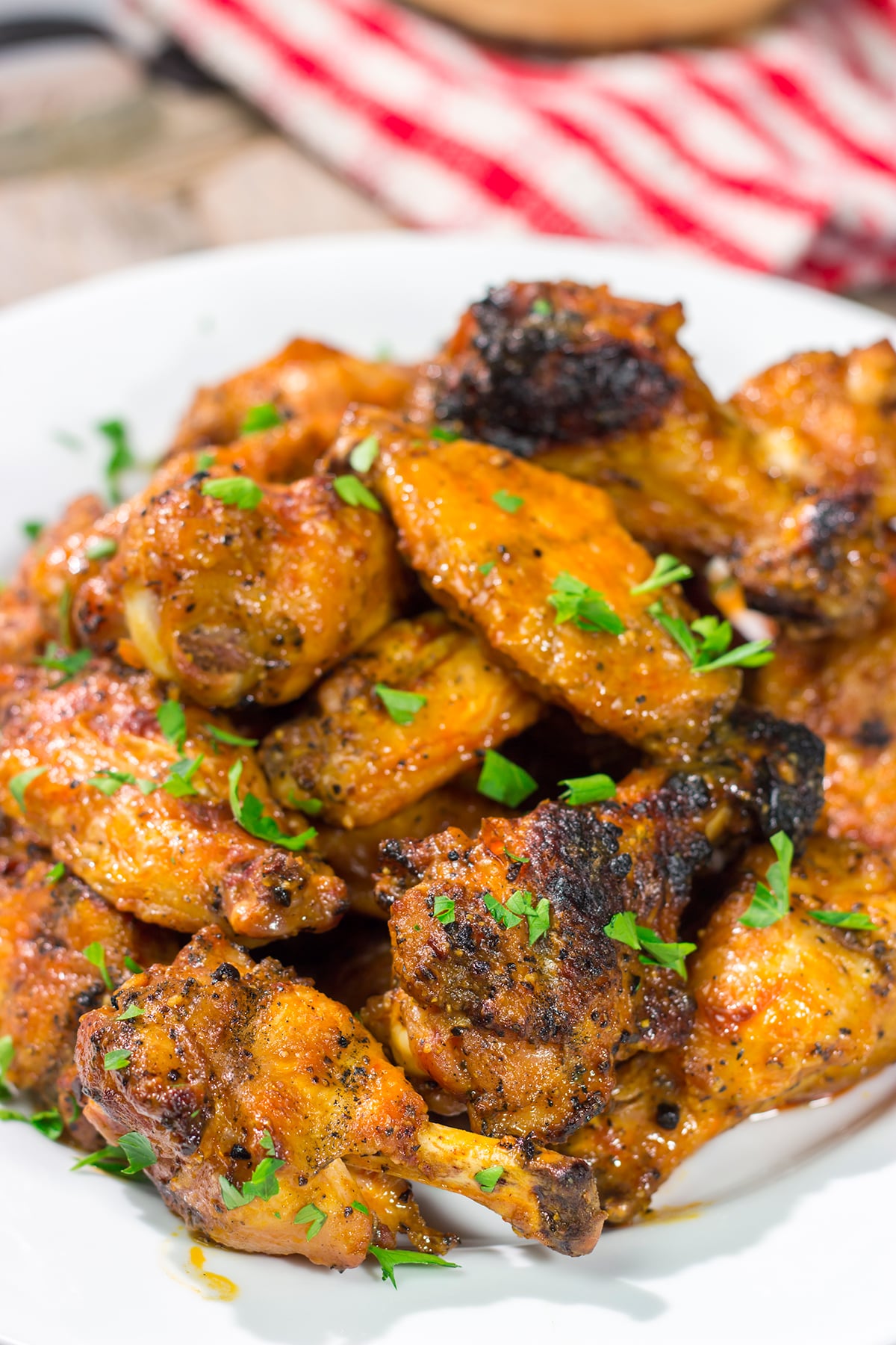 These Grilled Buffalo Wings are juicy and delicious - and tossed in an easy homemade buffalo sauce. Fire up the grill and invite some friends over!