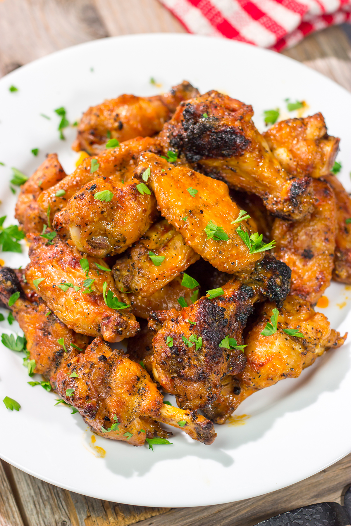These Grilled Buffalo Wings are juicy and delicious - and tossed in an easy homemade buffalo sauce. Fire up the grill and invite some friends over!