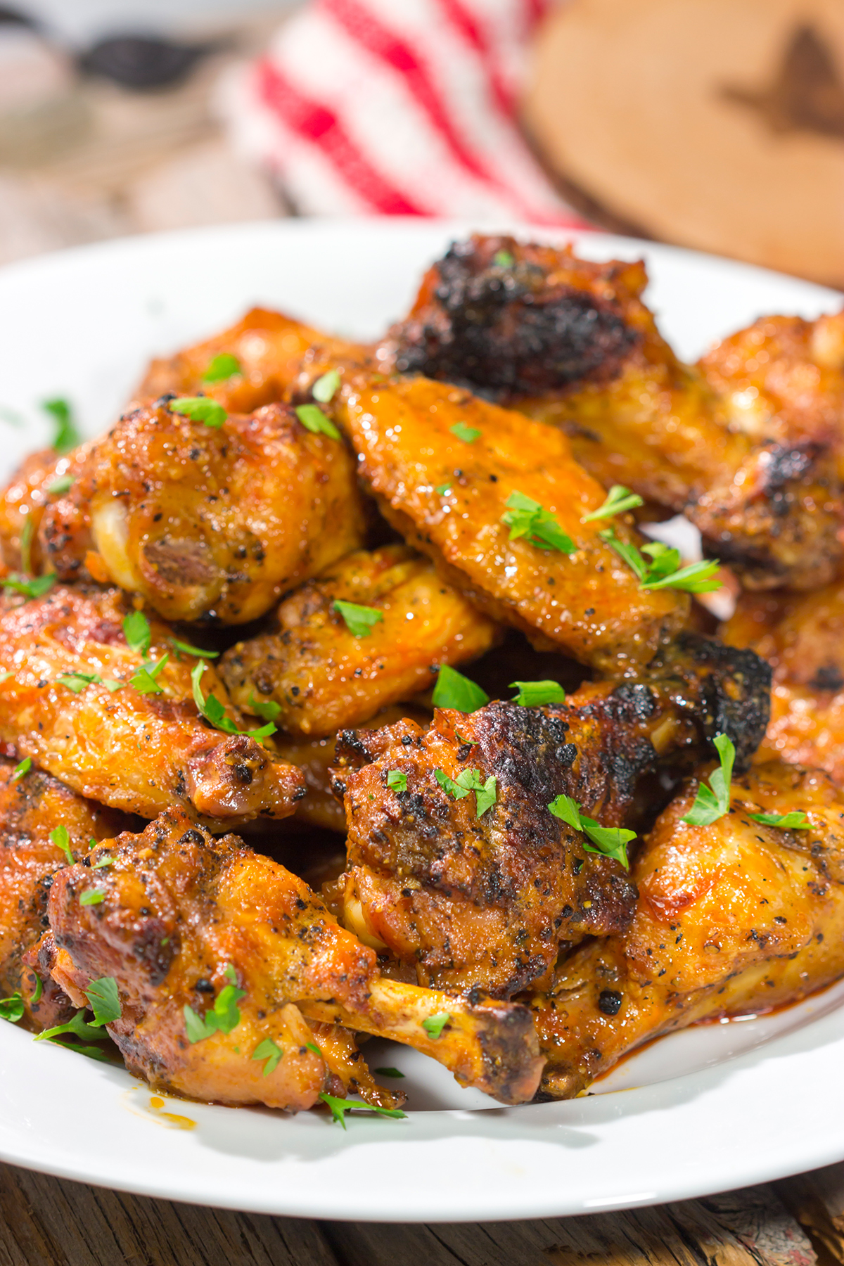 These Grilled Buffalo Wings are juicy and delicious - and tossed in an easy homemade buffalo sauce. Fire up the grill and invite some friends over!