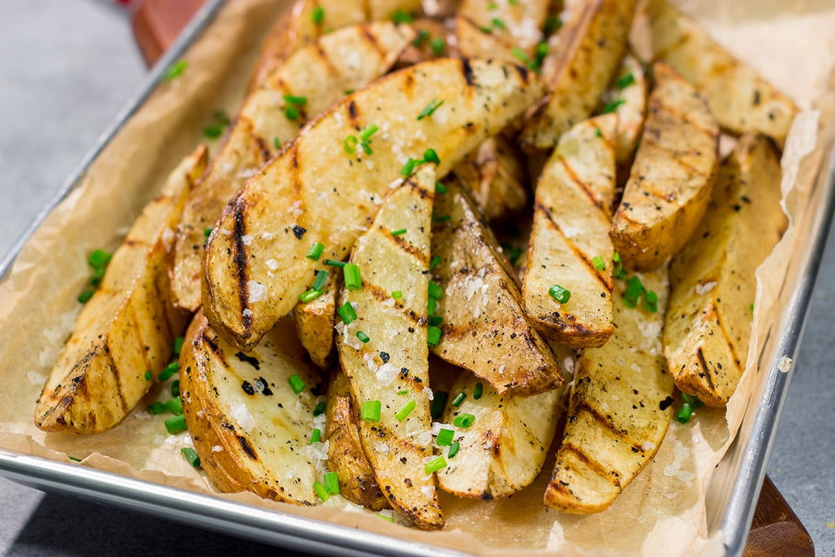 Put a salt and vinegar spin on grilled potato wedges with this Grilled Salt and Vinegar Potatoes recipe. This is a delicious side dish for summer grilling!