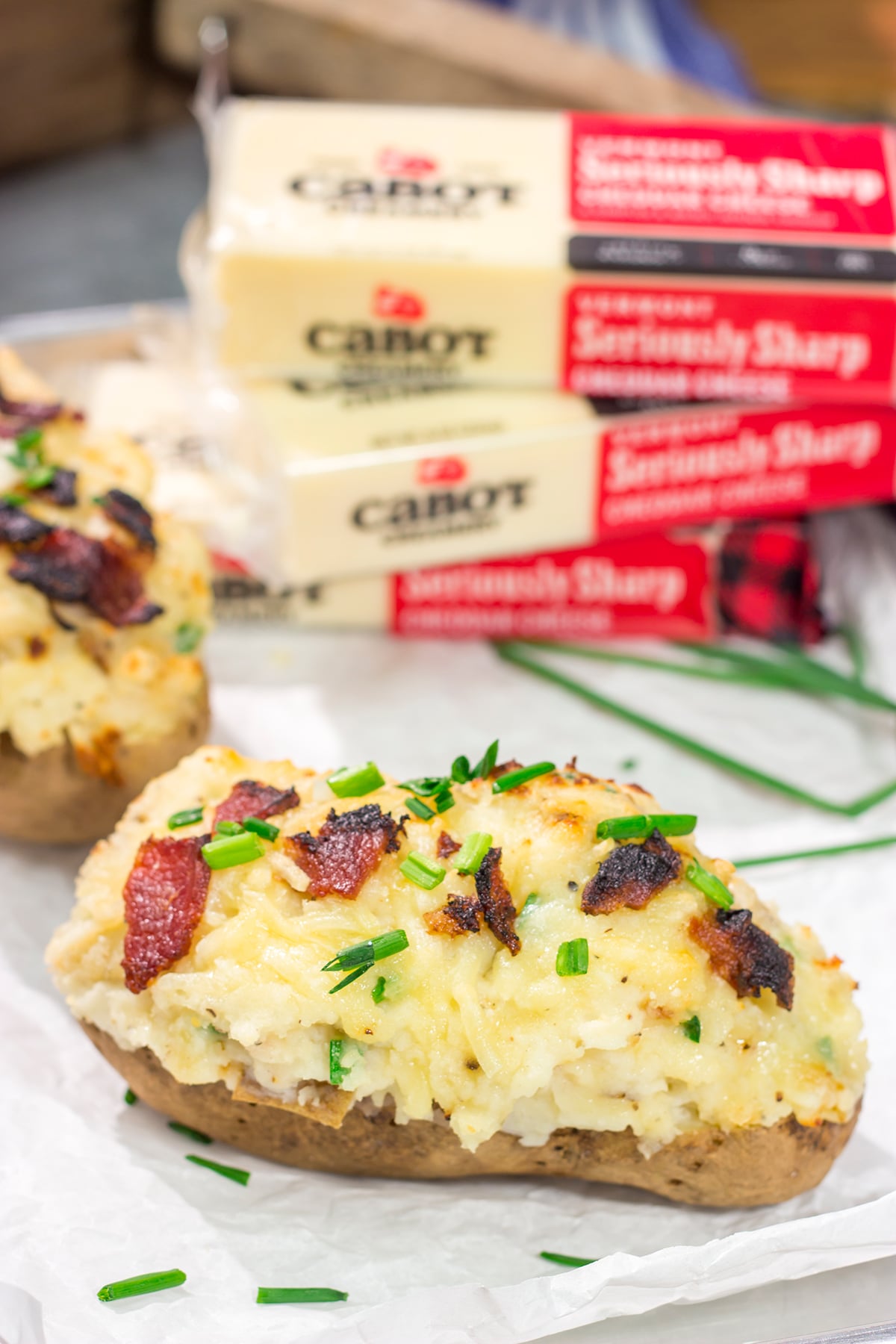 These Grilled Twice-Baked Potatoes feature crispy potato skins filled with creamy mashed potatoes combined with all of your favorite toppings. Add in the grill flavor and you've got one heck of a recipe!